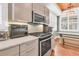 Modern kitchen with stainless steel appliances and white marble counters at 318 Simmons Ave, Summerville, SC 29483
