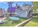 Spacious backyard with pool, detached garage and lush landscaping at 318 Simmons Ave, Summerville, SC 29483