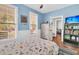 Light blue bedroom with dinosaur bedding and built in shelving at 318 Simmons Ave, Summerville, SC 29483