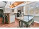 Open concept kitchen with a farmhouse style table and bench at 318 Simmons Ave, Summerville, SC 29483