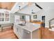 Kitchen island with marble countertop and farmhouse-style sink at 318 Simmons Ave, Summerville, SC 29483