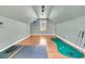 Upper level game room with putting green, exercise mats, and hardwood floors at 318 Simmons Ave, Summerville, SC 29483