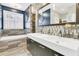 Modern bathroom with double vanity, walk-in shower, and tiled floors at 318 Simmons Ave, Summerville, SC 29483