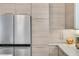 Sleek kitchen featuring stainless steel refrigerator and light wood cabinets at 318 Simmons Ave, Summerville, SC 29483
