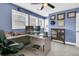 Spacious home office with a corner desk, two monitors, and built-in shelving at 318 Simmons Ave, Summerville, SC 29483