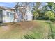 Backyard with a wooden swing set and a tree at 318 Simmons Ave, Summerville, SC 29483