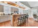 Modern kitchen with wooden breakfast bar, stainless steel appliances, and hardwood floors at 318 Simmons Ave, Summerville, SC 29483