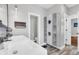 Modern bathroom with double vanity, storage cabinet, and gray tile flooring at 318 Simmons Ave, Summerville, SC 29483