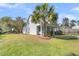 Charming house with a palm tree, green lawn, and playset at 318 Simmons Ave, Summerville, SC 29483