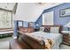 Charming bedroom with a wooden sleigh bed, window seat, and built-in storage at 318 Simmons Ave, Summerville, SC 29483