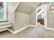 Cozy bedroom with window seat, built-in shelving, and access to another room at 318 Simmons Ave, Summerville, SC 29483