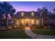 Charming house with a welcoming front porch and landscaped yard at 318 Simmons Ave, Summerville, SC 29483