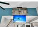 Hidden TV lift with beach scene displayed in a contemporary home at 318 Simmons Ave, Summerville, SC 29483