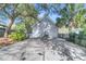 Two-car garage with a driveway and landscaping at 318 Simmons Ave, Summerville, SC 29483