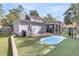 Landscaped backyard with a pool and detached garage at 318 Simmons Ave, Summerville, SC 29483
