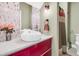Modern bathroom with red vanity, vessel sink, and updated fixtures at 318 Simmons Ave, Summerville, SC 29483