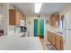 Kitchen with wood cabinets, white countertops, and a breakfast bar at 513 Dolphin St, Edisto Island, SC 29438
