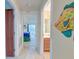 Hallway with light wood floors, leading to bedrooms and bath at 513 Dolphin St, Edisto Island, SC 29438