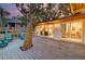 Large deck with tree, seating, and views of the backyard at 513 Dolphin St, Edisto Island, SC 29438
