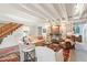 Gathering room with exposed beams, stone fireplace, and ample seating at 40 1/2 State St, Charleston, SC 29401