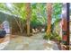 Private courtyard with lush landscaping and patio furniture at 40 1/2 State St, Charleston, SC 29401