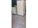 White stove and refrigerator in a kitchen with light gray tile floor at 8266 N Highway 17, McClellanville, SC 29458
