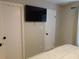 Bedroom with large TV mounted on the wall, and neutral tones at 265 Sea Cloud Cir, Edisto Island, SC 29438