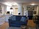 Open living room with gray couch and access to kitchen at 265 Sea Cloud Cir, Edisto Island, SC 29438