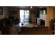 Spacious living room with access to deck and fireplace at 265 Sea Cloud Cir, Edisto Island, SC 29438