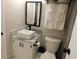 Modern bathroom with white vanity, marble countertop, and black accents at 265 Sea Cloud Cir, Edisto Island, SC 29438