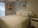 King-size bed in spacious bedroom with calming decor and natural light at 265 Sea Cloud Cir, Edisto Island, SC 29438