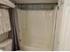 Bathroom with tub shower combo and gray accents at 265 Sea Cloud Cir, Edisto Island, SC 29438