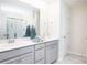 Double vanity bathroom with a large mirror and shower at 622 Red Monarch Way, Moncks Corner, SC 29461