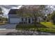 Two story gray house with white garage door and front porch at 417 Crystal Oaks Ln, Moncks Corner, SC 29461