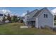 Grey two-story house with solar panels and screened porch at 417 Crystal Oaks Ln, Moncks Corner, SC 29461