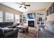 Spacious living room with fireplace, built-in shelving, and hardwood floors at 417 Crystal Oaks Ln, Moncks Corner, SC 29461