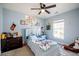 Bright bedroom with a ceiling fan and large window at 417 Crystal Oaks Ln, Moncks Corner, SC 29461