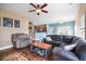 Bright living room offering hardwood floors and views of the kitchen at 417 Crystal Oaks Ln, Moncks Corner, SC 29461