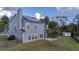 Grey two-story house with solar panels and screened porch at 417 Crystal Oaks Ln, Moncks Corner, SC 29461
