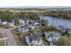 Aerial view of house with solar panels near a lake at 417 Crystal Oaks Ln, Moncks Corner, SC 29461