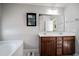Double vanity bathroom with a large soaking tub at 417 Crystal Oaks Ln, Moncks Corner, SC 29461