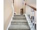 Carpeted staircase with wooden handrail leading to the upper level at 417 Crystal Oaks Ln, Moncks Corner, SC 29461