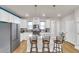 Modern kitchen with white cabinets, stainless steel appliances, and an island at 219 Winding River Dr, Johns Island, SC 29455