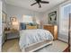 Cozy bedroom with a comfortable bed, wooden dresser, and artwork on the walls at 52 Laurens St, Charleston, SC 29401