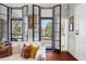 Living room with French doors and comfortable seating at 52 Laurens St, Charleston, SC 29401