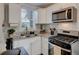 Charming kitchen featuring modern appliances and granite countertops at 52 Laurens St, Charleston, SC 29401