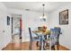 Charming dining area with a table for four and a modern light fixture at 7928 Shadow Oak Dr, North Charleston, SC 29406