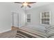 Bedroom with striped bedding and large windows at 2460 Deer Ridge Ln # 1, North Charleston, SC 29406