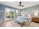 Serene bedroom with sliding doors to balcony and ceiling fan at 64 Grand Pavilion Blvd, Isle of Palms, SC 29451