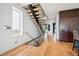 Elegant glass and wood staircase leading to the upper level at 64 Grand Pavilion Blvd, Isle of Palms, SC 29451